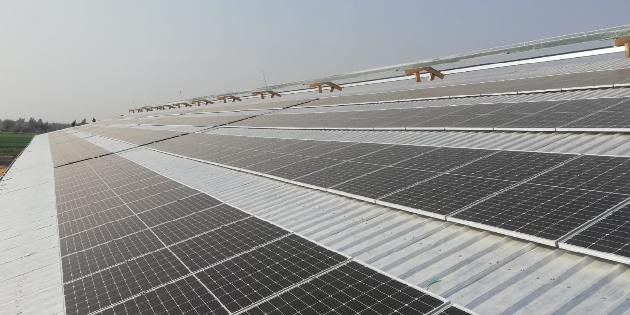 Solar panels on a rooftop in Pakistan receiving sunlight, illustrating tips to increase efficiency. of solar panel